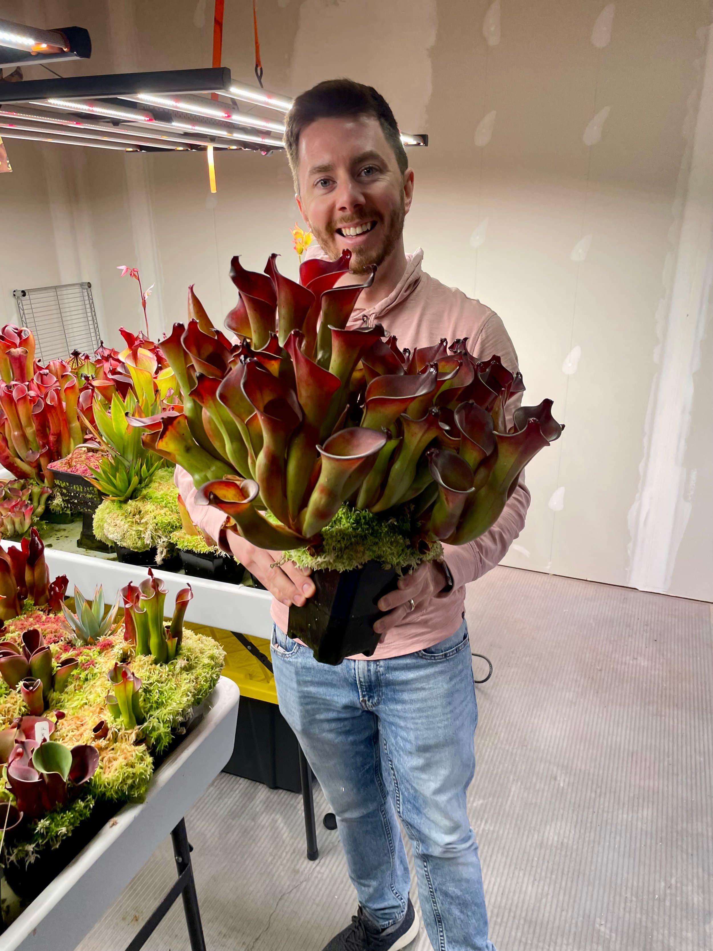 Matthew Kammerer holding a large Heliamphora